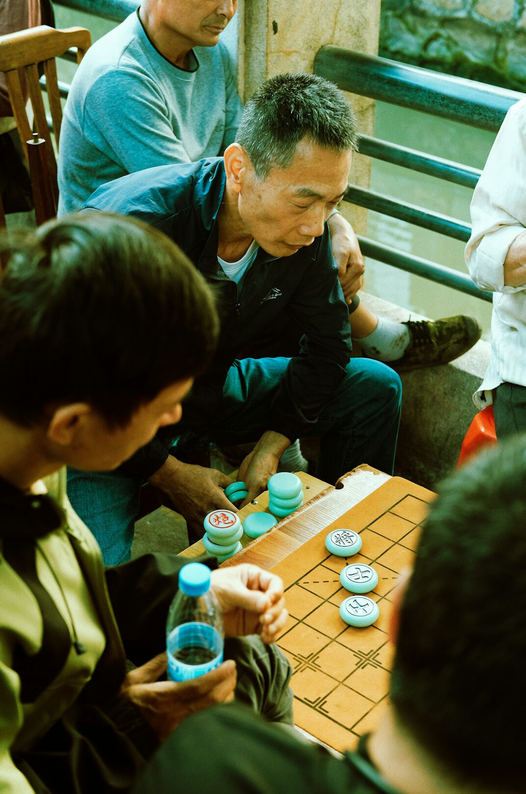 Moderator leading a focus group discussion with participants seated around a table