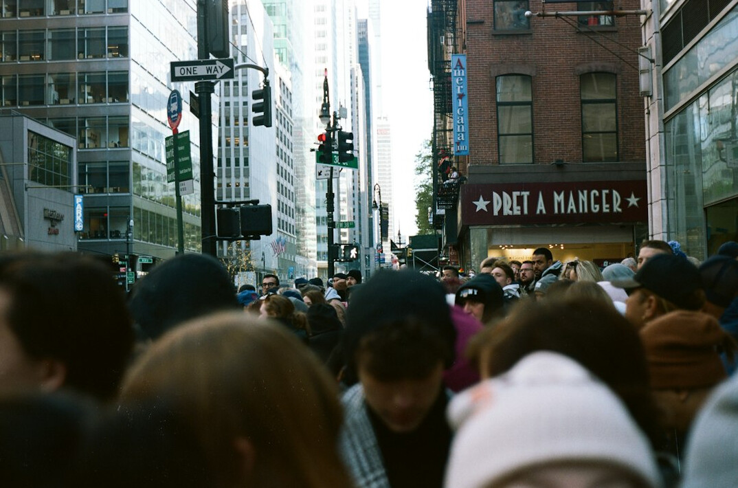 crowd of diverse people in city