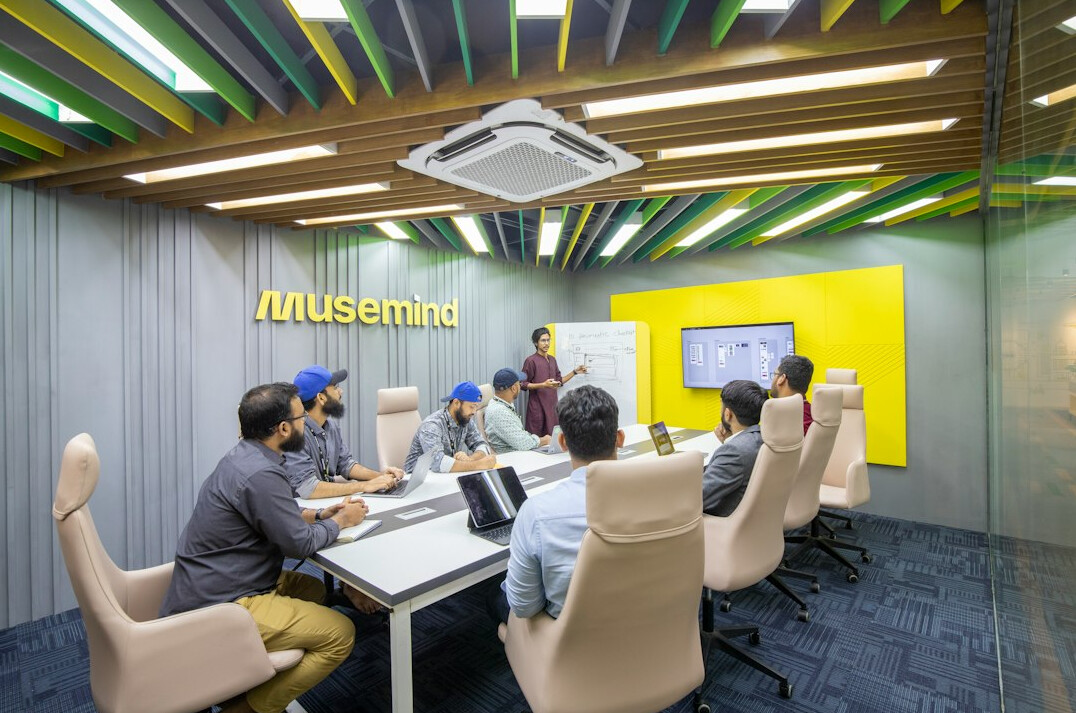 people discussing in meeting room
