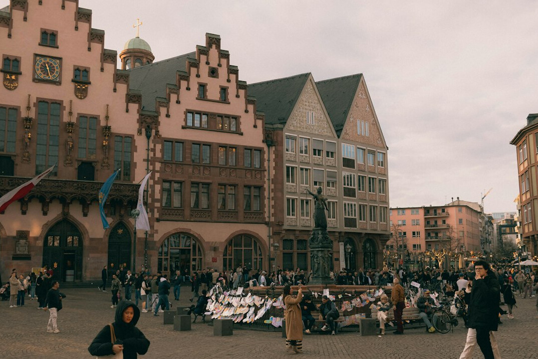 Diverse crowd at an outdoor cultural festival in a German city square